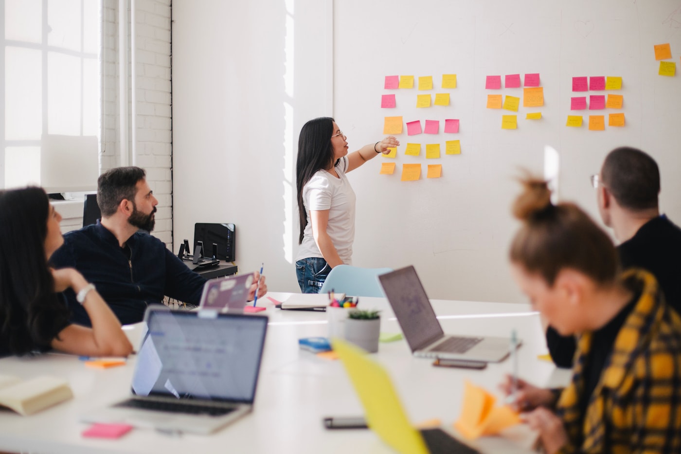 A team meeting around a table in an office